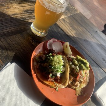 Las Guerreras signature dishes Chicken Pozole VerdeEnchiladas VerdesPesacdo Taco